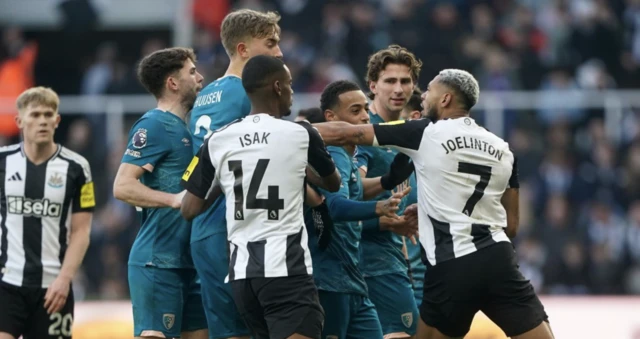 Newcastle United's Joelinton (right) clashes with Bournemouth players