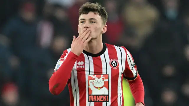 Harrison Burrows blows a kiss to the Sheffield United fans