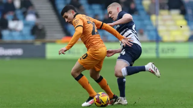 Millwall's Casper De Norre closes down Hull's Gustavo Puerta