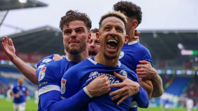 Cardiff players celebrate with Callum Robinson