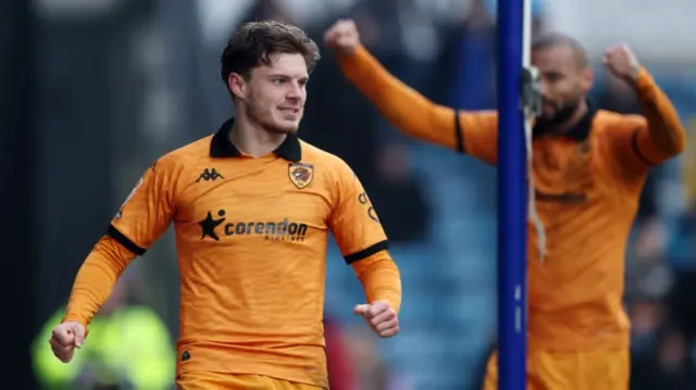 Regan Slater celebrates after Jake Cooper's own goal gives Hull the lead at Millwall