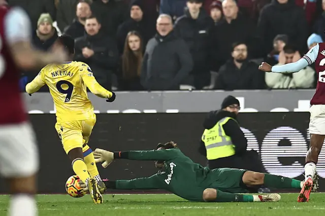 Lukasz Fabianski brings down Crystal Palace's English striker Eddie Nketiah