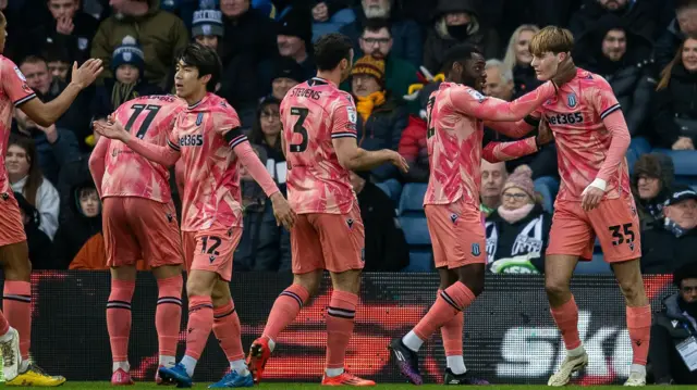 Stoke players celebrate with goalscorer Nathan Lowe