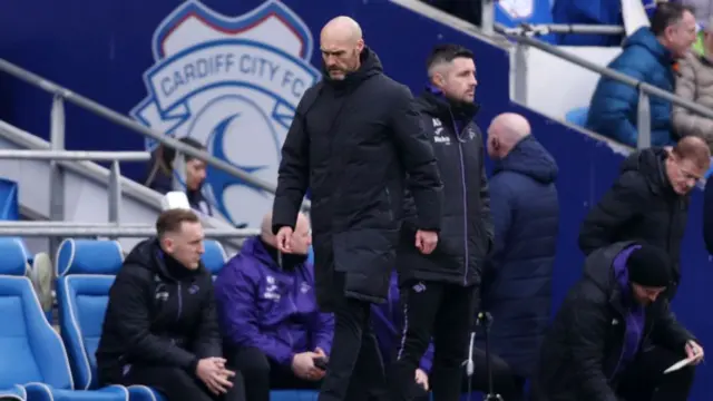 Swansea manager Luke Williams has his head down