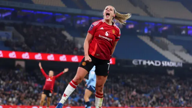 Ella Toone of Manchester United scores her team's first goal during the Barclays Women's Super League match between Manchester City and Manchester United