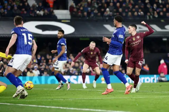 Phil Foden of Manchester City scores his team's third goal