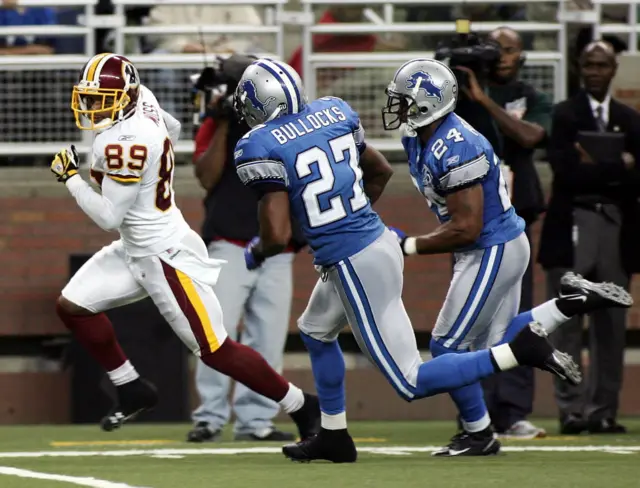 Santana Moss of the Washington Redskins runs for a touchdown against the Detroit Lions in 2008