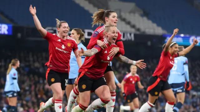 Leah Galton of Manchester United celebrates scoring her team's second goal with team mates during the Barclays Women's Super League match between Manchester City and Manchester United