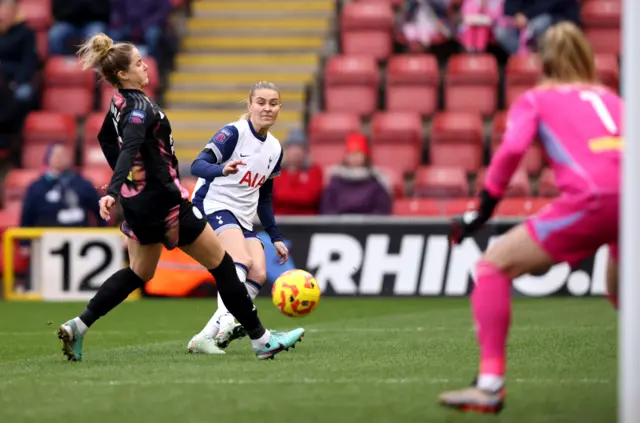 Amanda Nilden of Tottenham Hotspur shot is deflected off Janina Leitzig of Leicester City