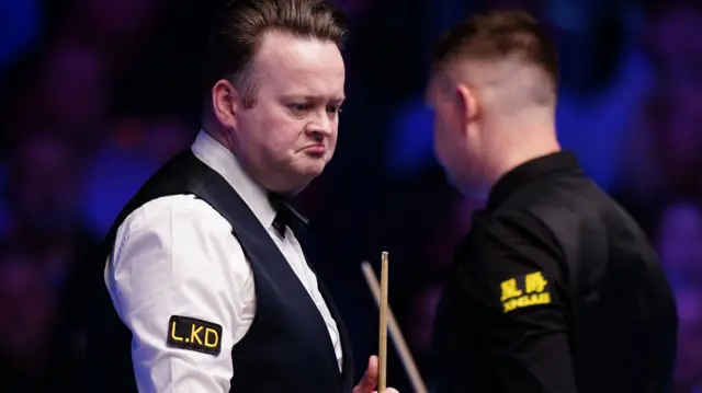 Shaun Murphy looks on