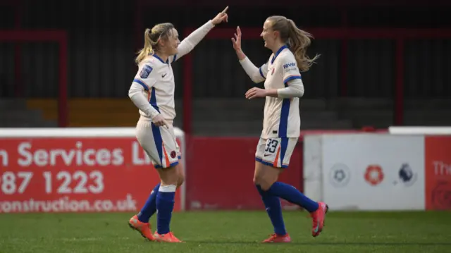 Erin Cuthbert of Chelsea celebrates with teammate Aggie Beever-Jones after scoring her team's second goal during the Barclays Women's Super League Match between West Ham United v Chelsea FC