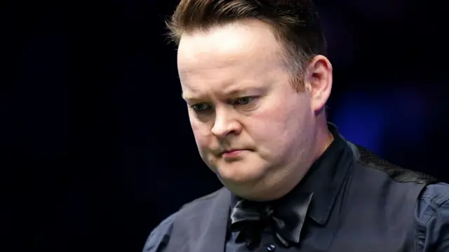 Shaun Murphy looks on