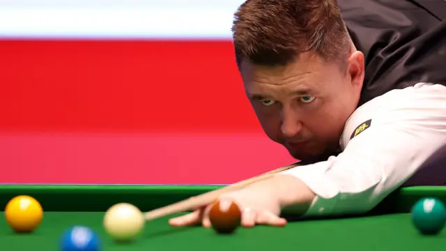 Kyren Wilson plays a shot