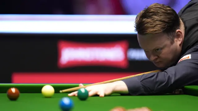 Shaun Murphy plays a shot