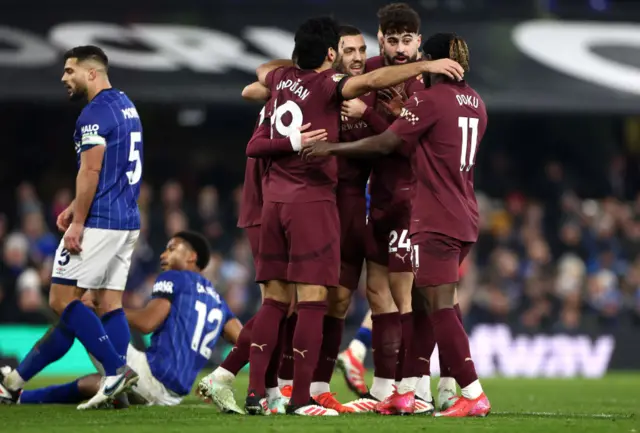 Mateo Kovacic of Manchester City celebrates with Ilkay Guendogan, Josko Gvardiol and Jeremy Doku