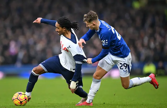 Djed Spence of Tottenham Hotspur is challenged by Jesper Lindstrom