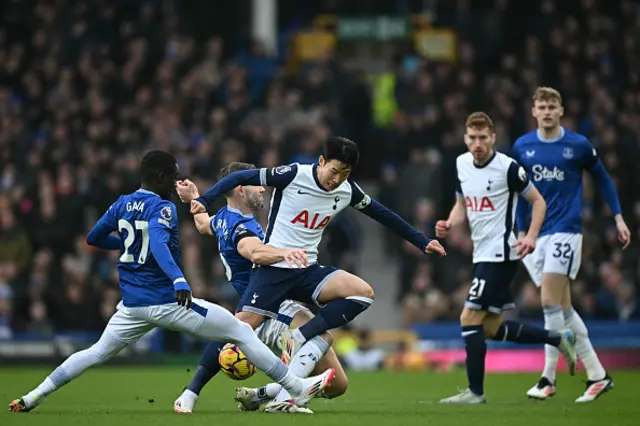 Son Heung-Min (C) vies fro the ball