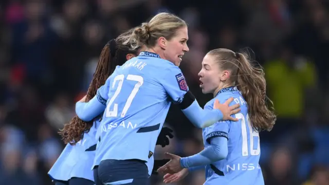 Rebecca Knaak of Manchester City celebrates scoring her team's second goal with Jess Park during the Barclays Women's Super League match between Manchester City and Manchester United