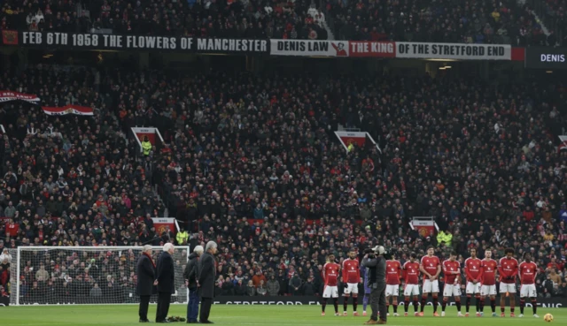 Manchester United players during a minutes silence