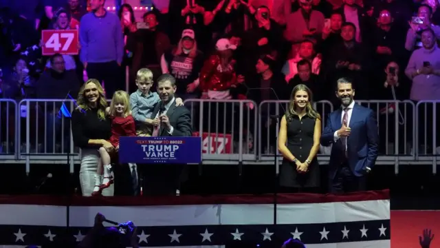 Eric and Lara Trump on stage with their two children, with Donald Trump Jr. with his daughter Kai