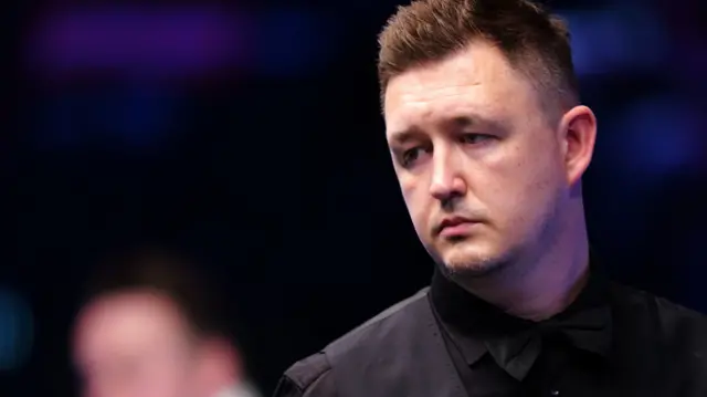 Kyren Wilson looks on