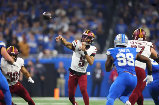 Washington Commanders quarterback Jayden Daniels makes a pass against the Detroit Lions