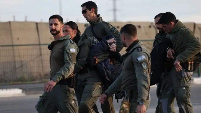 Israeli police arresting a far-right activist protesting outside the West Bank military prison of Ofer