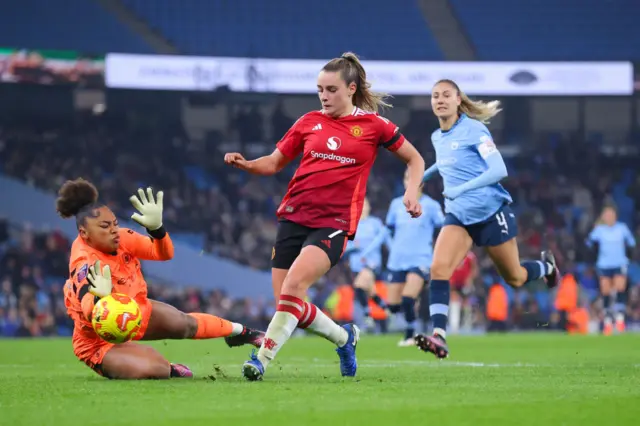 Ella Toone slides in her second goal