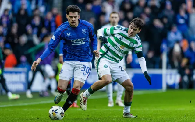 GLASGOW, SCOTLAND - JANUARY 02: Rangers' Ianis Hagi (L) and Celtic's Paulo Bernardo in action during a William Hill Premiership match between Rangers and Celtic at Ibrox Stadium, on January 02, 2025, in Glasgow, Scotland.  (Photo by Craig Foy / SNS Group)