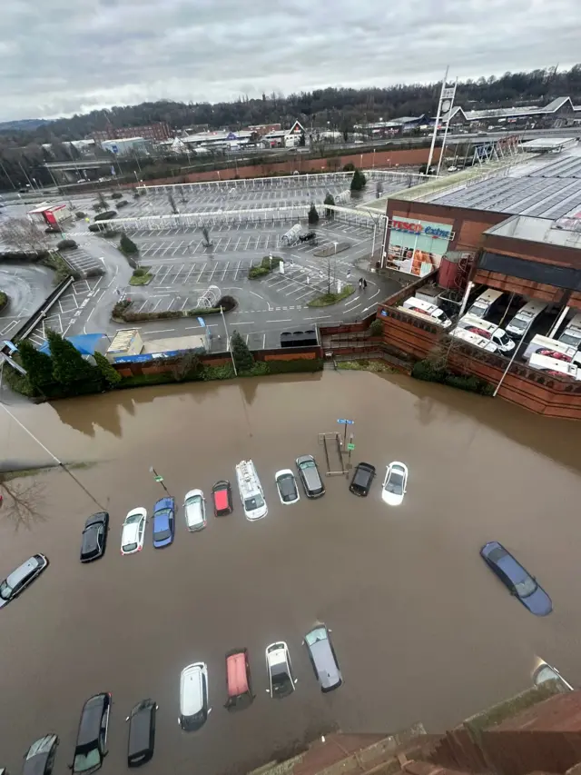 Cars submerged in flood water