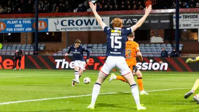 DUNDEE, SCOTLAND - JANUARY 02: Dundee's Finlay Robertson has a shot during a William Hill Premiership match between Dundee and Dundee United at the Scot Foam Stadium at Dens Park, on January 02, 2025, in Dundee, Scotland.  (Photo by Ross Parker / SNS Group)