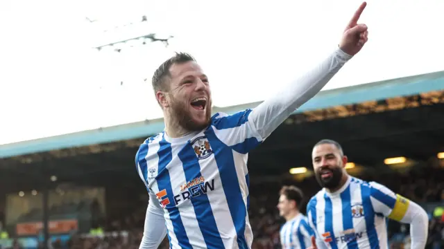 Bruce Anderson celebrates