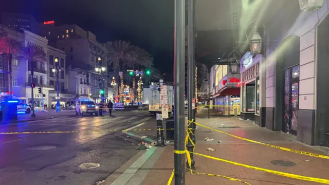 A street in New Orleans with police tape across it