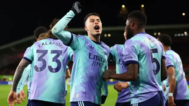 Arsenal players celebrate after going 2-1 in front against Brentford