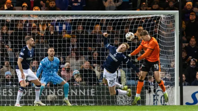 DUNDEE, SCOTLAND - JANUARY 02: Dundee United's Sam Dalby sends a header towards the target during a William Hill Premiership match between Dundee and Dundee United at the Scot Foam Stadium at Dens Park, on January 02, 2025, in Dundee, Scotland.  (Photo by Ross Parker / SNS Group)