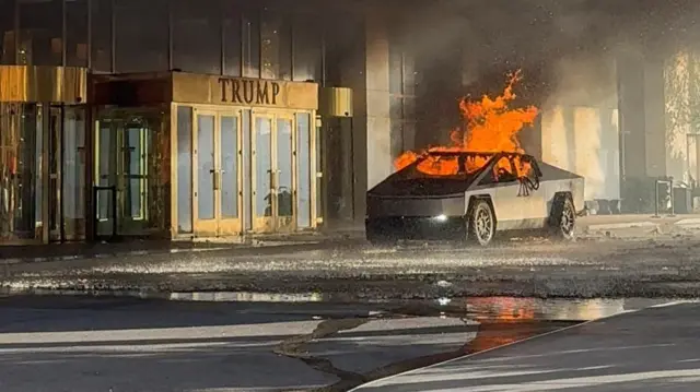 Flames rise from a Tesla Cybertruck after it exploded outside the Trump International Hotel Las Vegas, in Las Vegas, Nevada