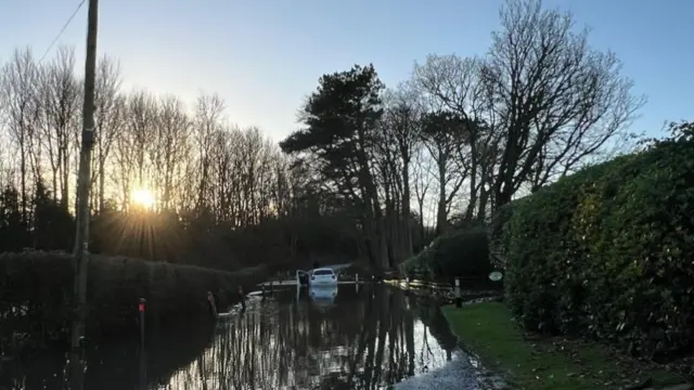 Stolen white BMW trapped by flooding