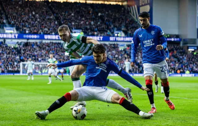 GLASGOW, SCOTLAND - JANUARY 02: Rangers' Ianis Hagi (R) and Celtic's Alistair Johnston in action during a William Hill Premiership match between Rangers and Celtic at Ibrox Stadium, on January 02, 2025, in Glasgow, Scotland.  (Photo by Craig Foy / SNS Group)