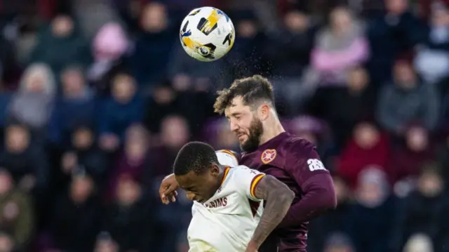 Motherwell's Tawanda Maswinhise and Hearts' Craig Halkett