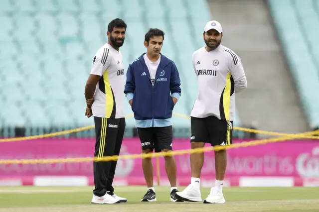 Rohit Sharma talks to Jasprit Bumrah and Gautam Gambhir