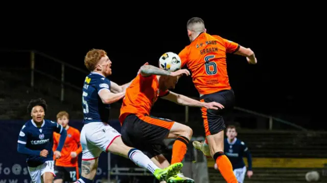 DUNDEE, SCOTLAND - JANUARY 02: Dundee United's Kevin Holt handles the ball for a penalty during a William Hill Premiership match between Dundee and Dundee United at the Scot Foam Stadium at Dens Park, on January 02, 2025, in Dundee, Scotland.  (Photo by Ewan Bootman / SNS Group)