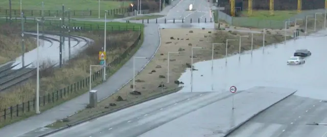 An A road in Manchester completely submerged in water