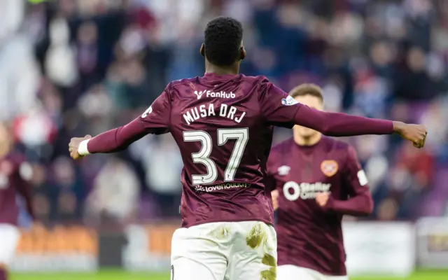 Musa Drammeh celebrates after scoring for Hearts against Motherwell