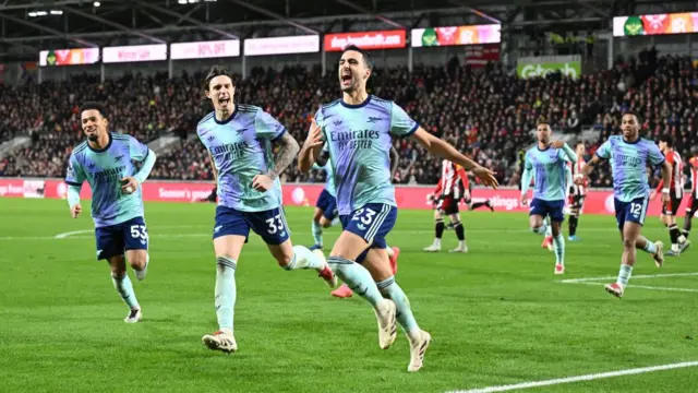 Mikel Merino celebrates after putting Arsenal 3-1 up against Brentford