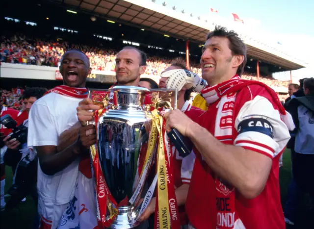 Arsenal holding the Premier League trophy in 1998