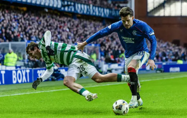 GLASGOW, SCOTLAND - JANUARY 02: Celtic's Paulo Bernardo (L) and Rangers' Ianis Hagi in action during a William Hill Premiership match between Rangers and Celtic at Ibrox Stadium, on January 02, 2025, in Glasgow, Scotland.  (Photo by Craig Foy / SNS Group)