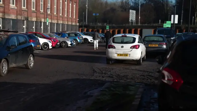 Mud-covered car park at Meadow Mill apartments in Stockport