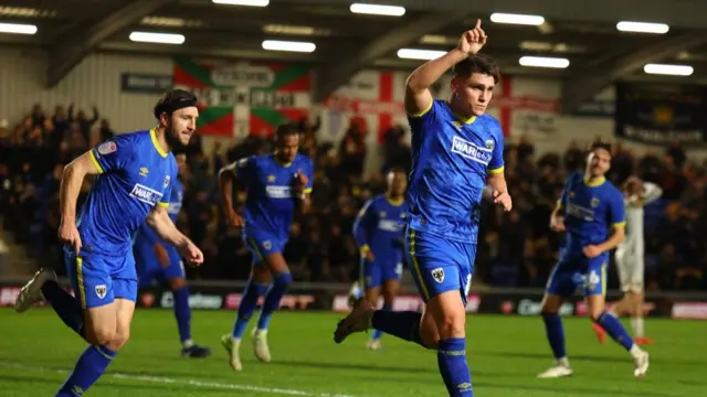 AFC Wimbledon's Matty Stevens celebrating his goal during their last match against Newport County in December