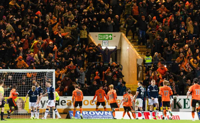 Dundee United players and fans celebrate the winning goal