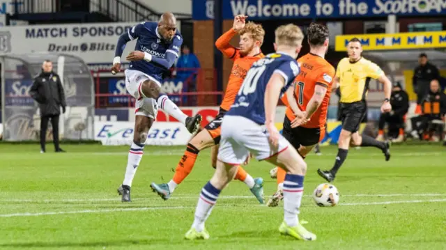 DUNDEE, SCOTLAND - JANUARY 02: Dundee's Mo Sylla has a shot during a William Hill Premiership match between Dundee and Dundee United at the Scot Foam Stadium at Dens Park, on January 02, 2025, in Dundee, Scotland.  (Photo by Ross Parker / SNS Group)